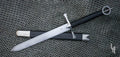 Irish Dagger with scabbard on mail background
