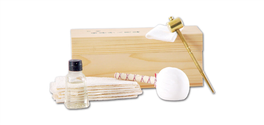 Hanwei Japanese Sword Maintenance Kit showing wooden box, choji oil bottle, rice papers, powder ball, brass awl and hammer
